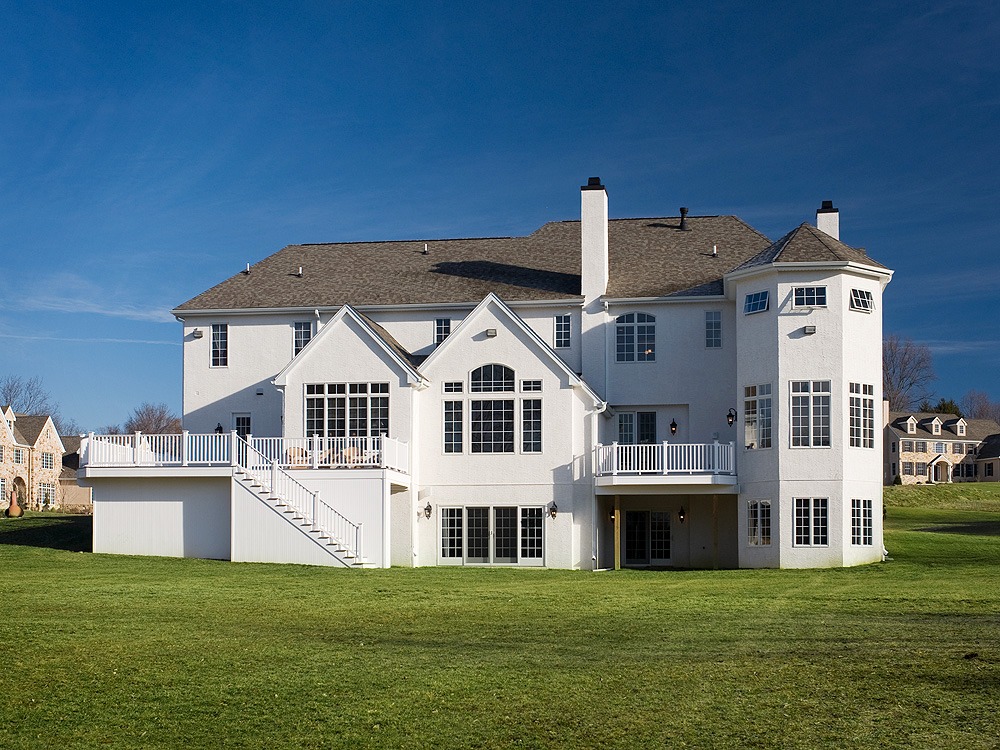 Custom home built on plot of land.